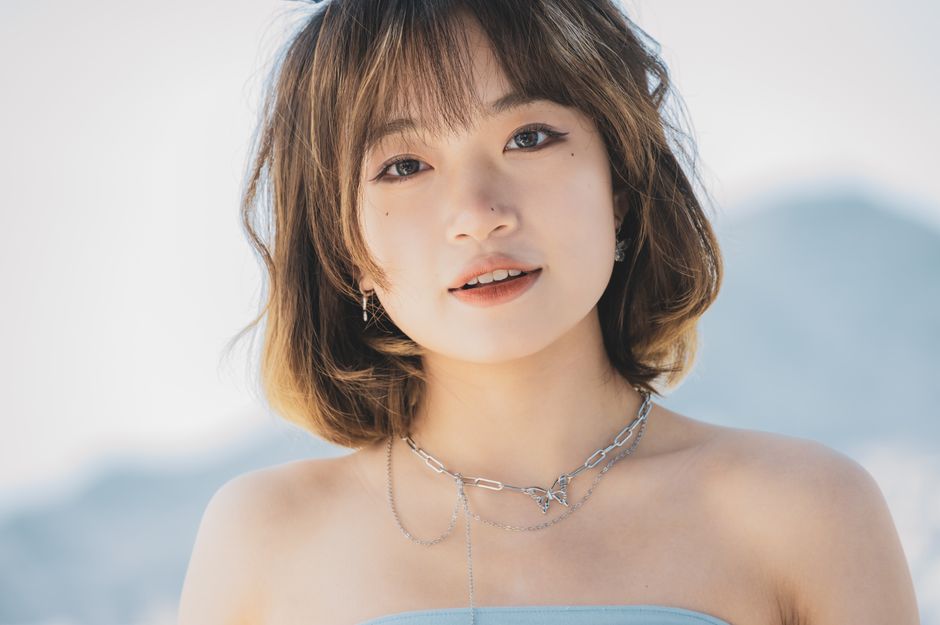 Close-up portrait of a stylish woman with necklace, outdoors in Montenegro.